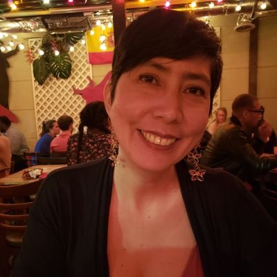 Photo of Marisol, a Latina woman wearing a black shirt